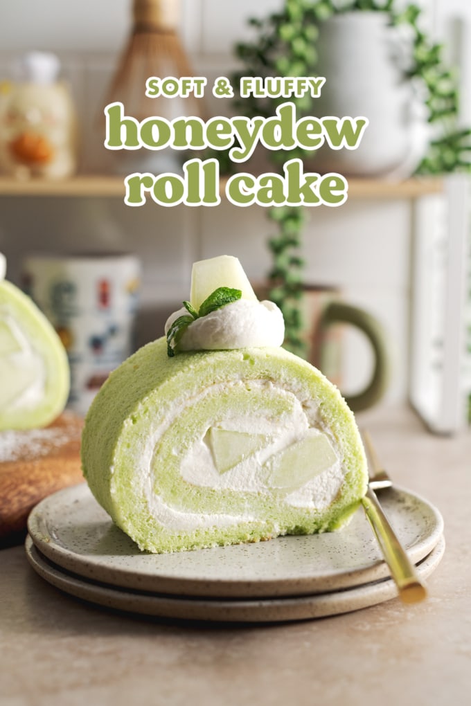 A slice of honeydew roll cake on a stack of plates.