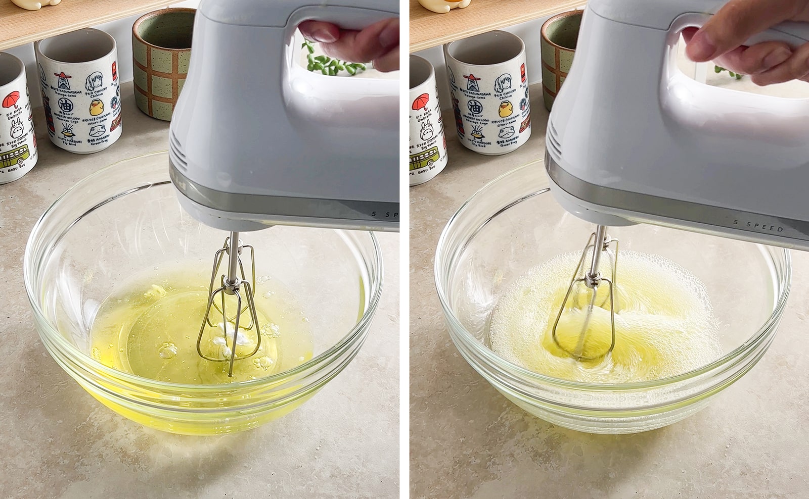 Beating egg whites with a hand mixer in a mixing bowl.