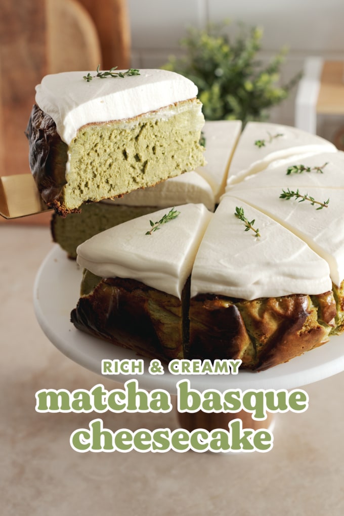 Lifting a slice of matcha basque cheesecake from the rest of the cake.