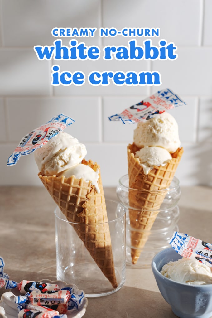 Two white rabbit ice cream cones standing up in glasses.