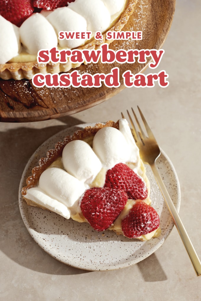 A slice of strawberry tart on a speckled plate with a gold fork.