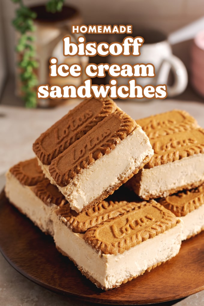Biscoff ice cream sandwiches stacked in a pile on a wooden plate.