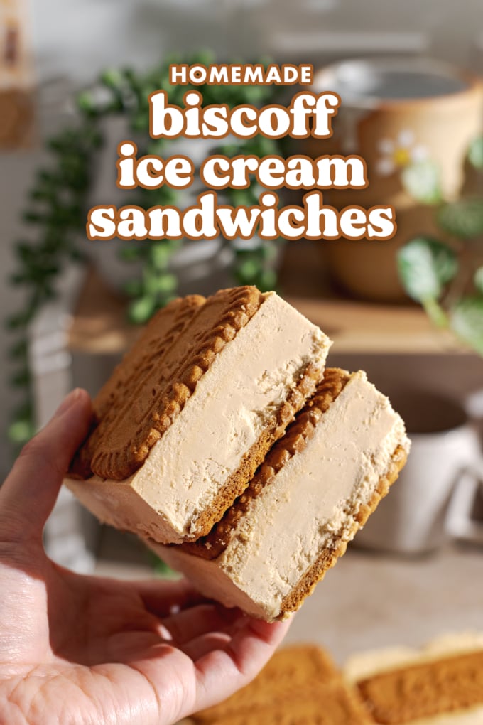Hand holding two biscoff ice cream sandwiches, showing the ice cream layer on the sides.