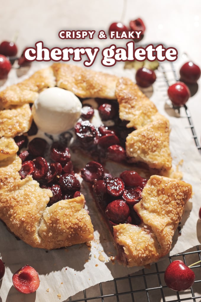 Cherry galette with a triangular slice cut out of it.