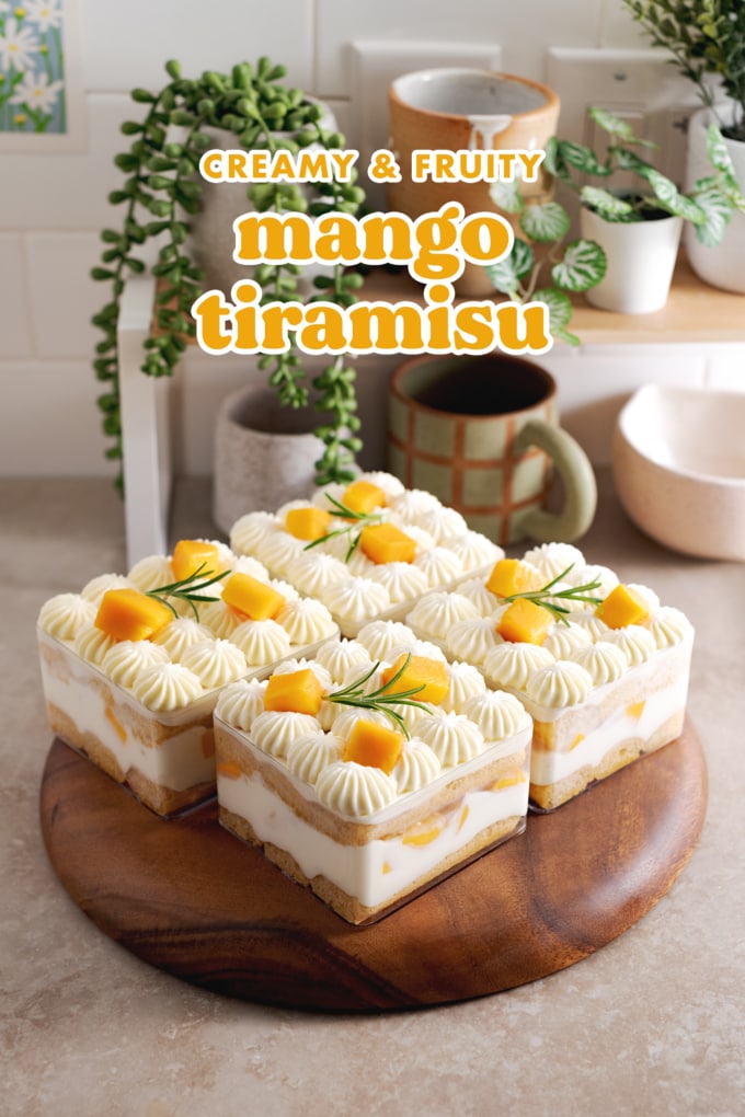 Individual containers of mango tiramisu on a kitchen counter with shelf in the back.