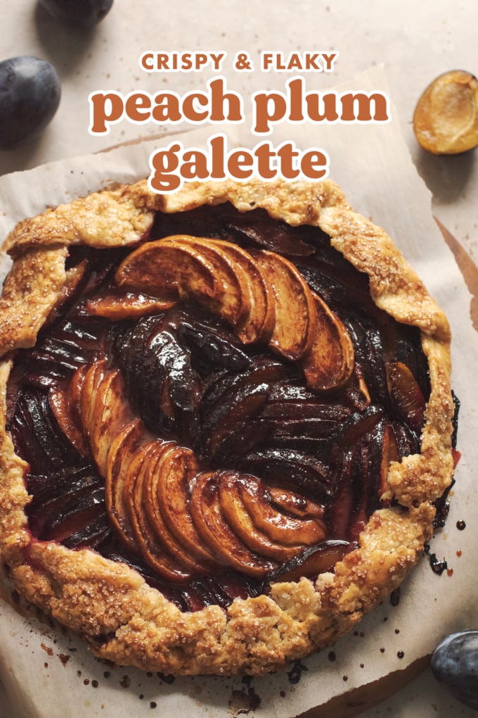Round galette filled with glossy slices of peaches and plums.