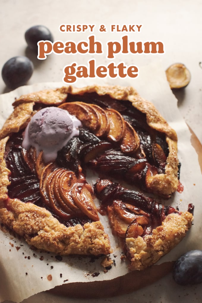 Peach plum galette with a slice cut out of it.