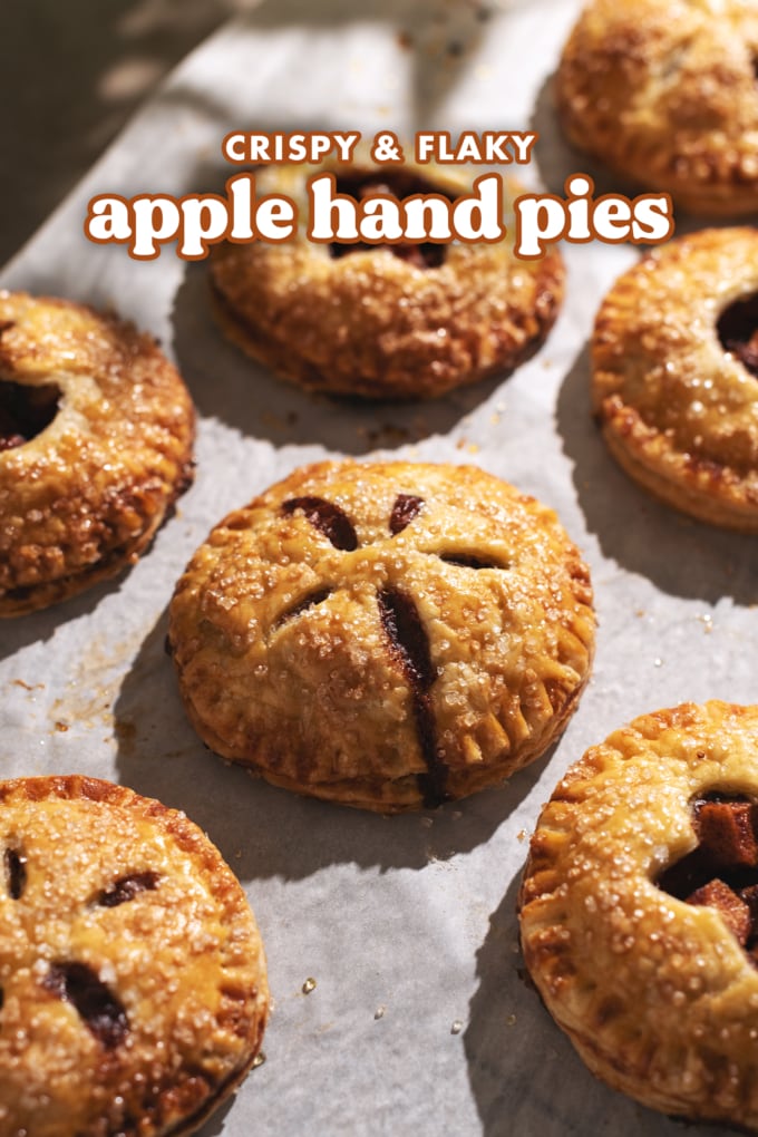 Mini apple hand pie with filling dripping out of it.