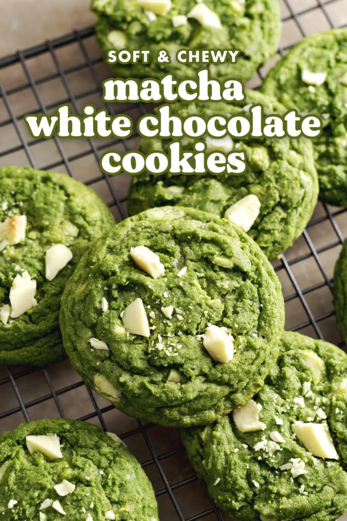 Matcha white chocolate cookies stacked on a wire rack.