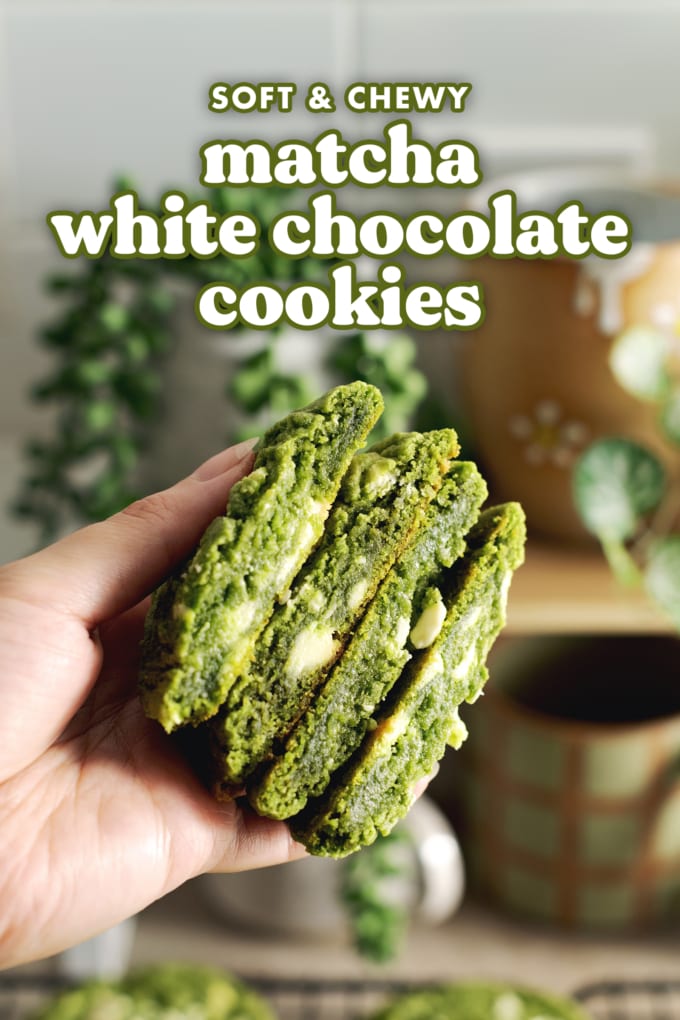 Hand holding four matcha cookies cut in half to show the gooey insides.