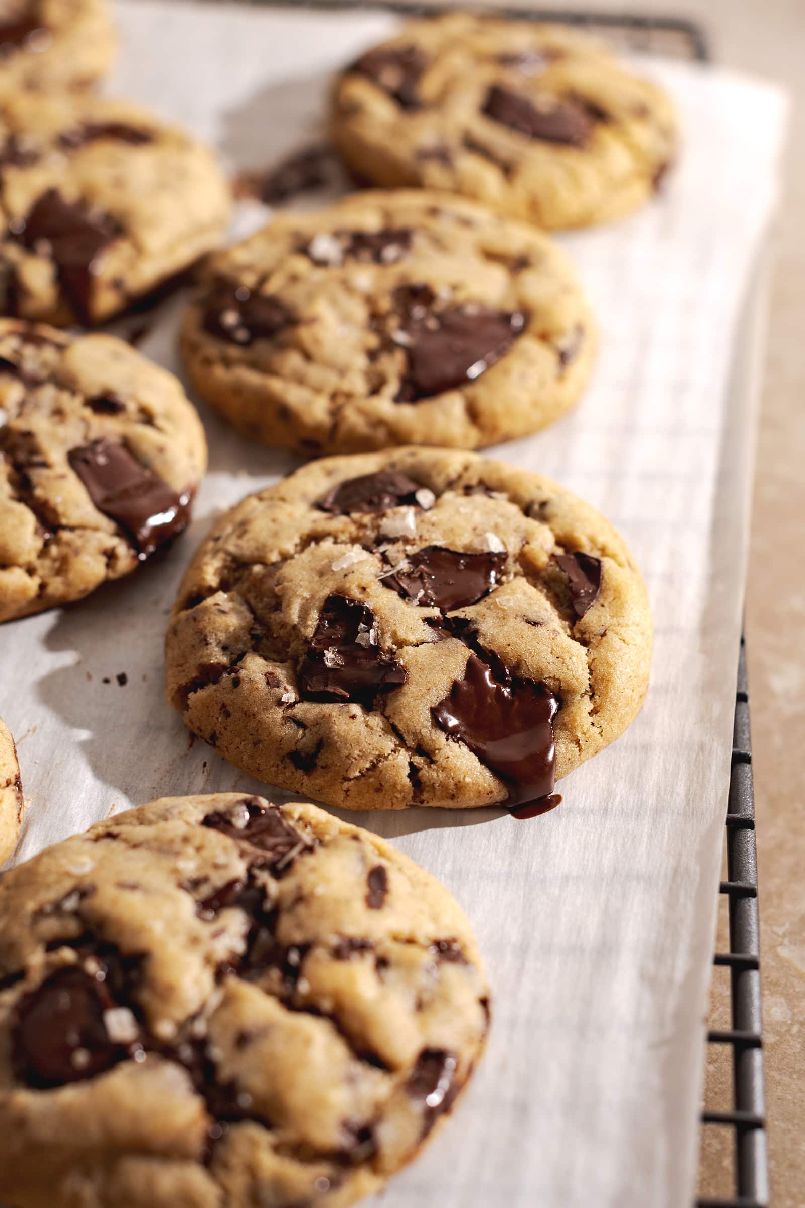 Miso cookies with melted chocolate dripping off the side of it.