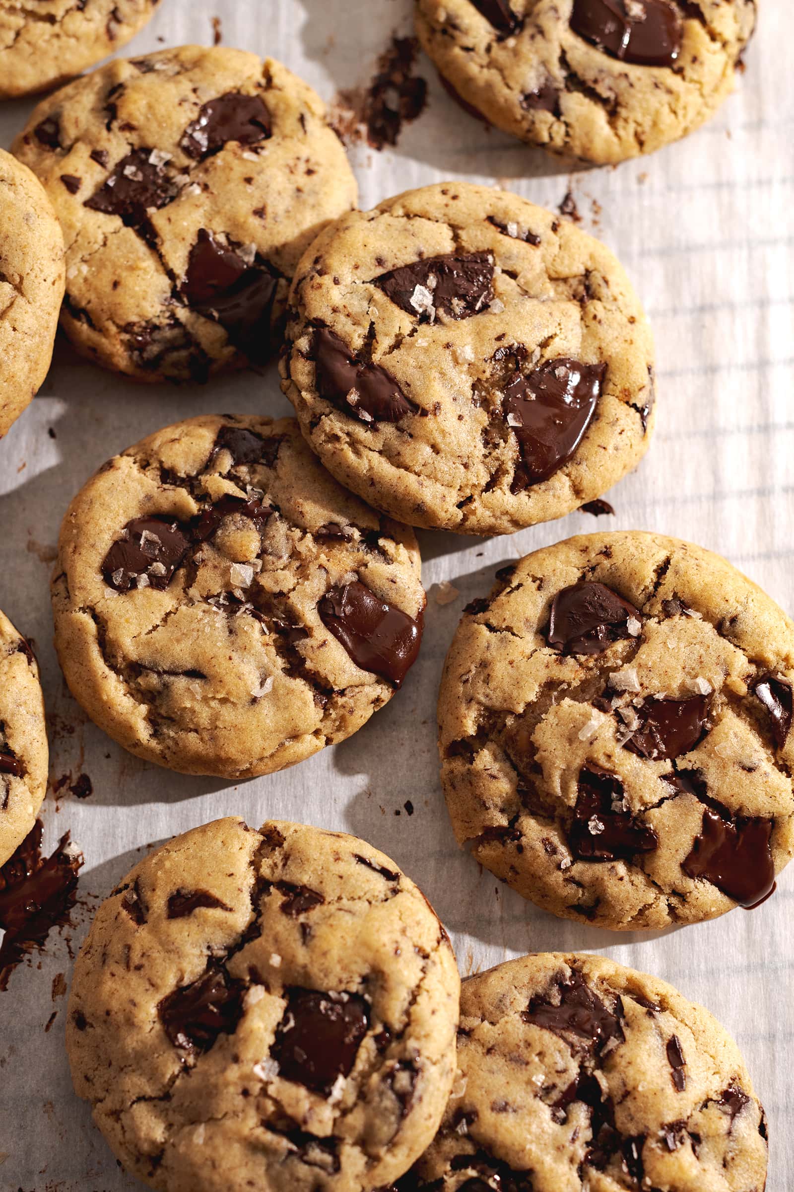 Miso cookies scattered on parchment paper.