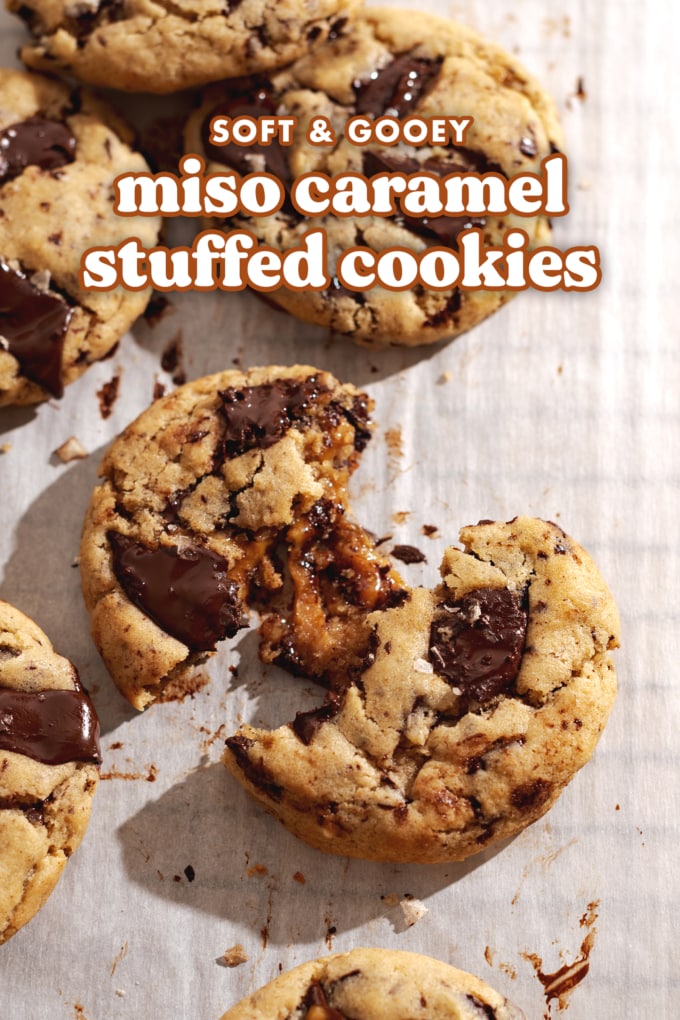 A miso caramel stuffed cookie pulled apart to show gooey caramel filling inside.