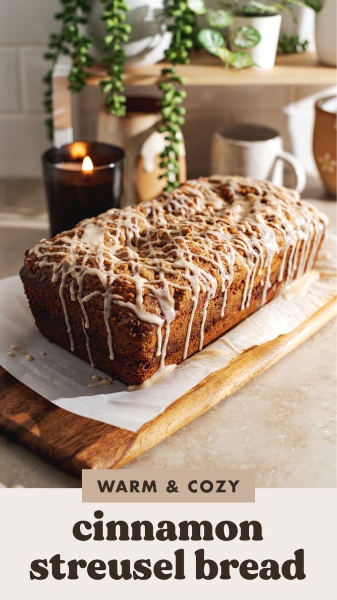 A loaf of cinnamon streusel bread drizzled with icing.