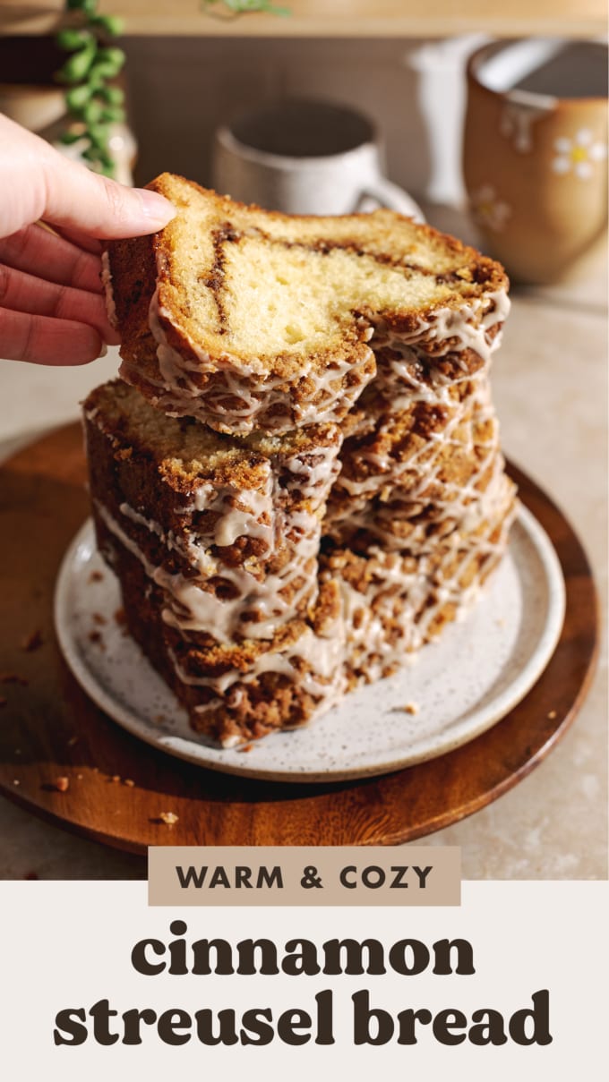 Hand placing a slice of streusel bread on top of a stack of slices.