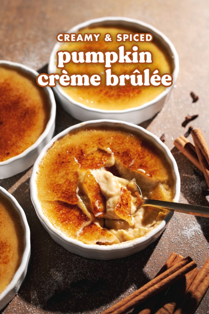 A spoon resting in a ramekin of cracked pumpkin crème brûlée.