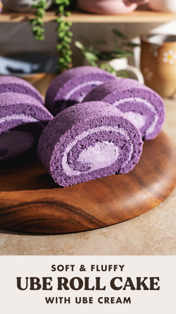 Slices of ube cake rolls lined up on a wooden platter.