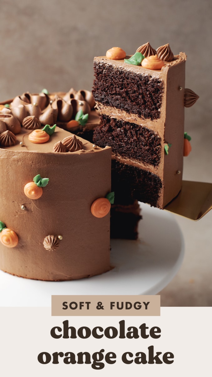 A slice of chocolate orange cake being lifted by a cake server from the rest of the cake.