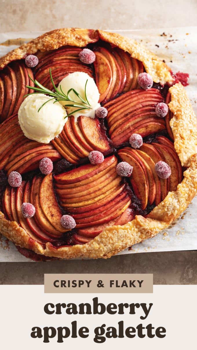 Top down view of a cranberry apple galette with thin apple slices and scoops of ice cream on top.