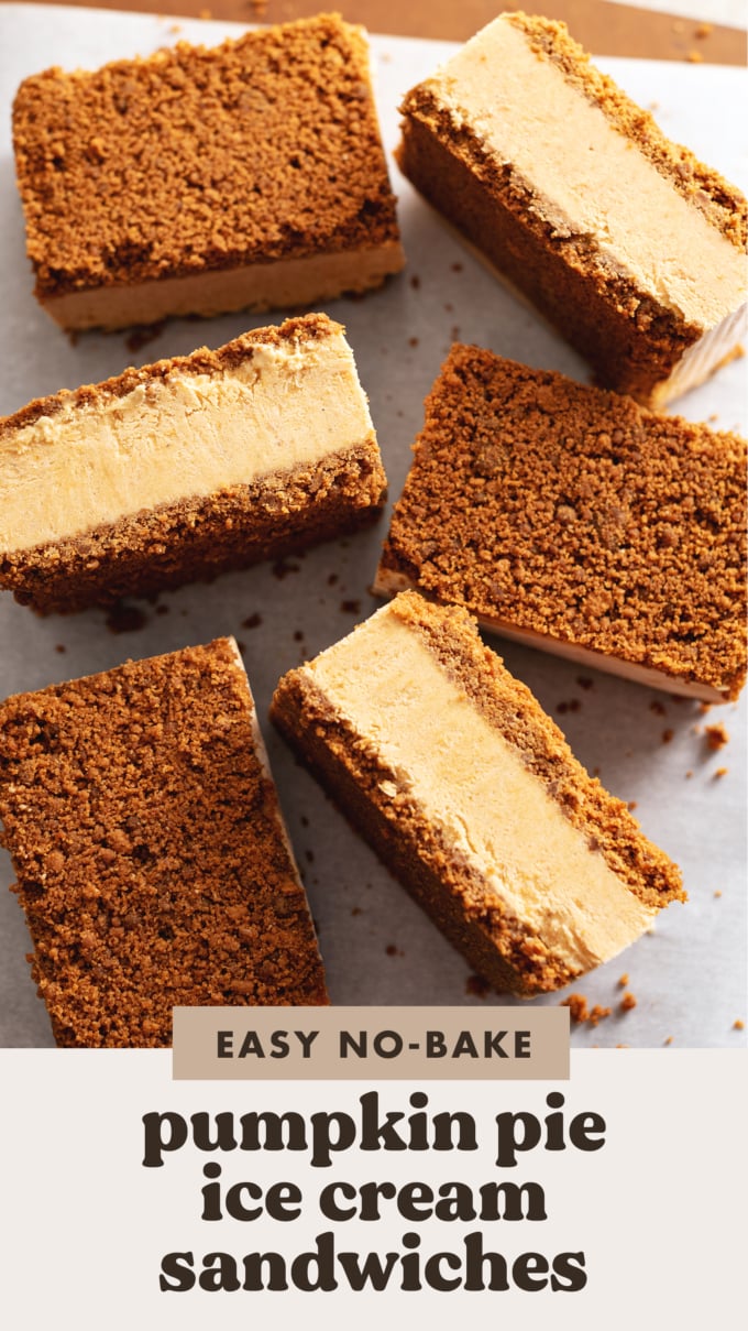 Pumpkin pie ice cream sandwiches scattered on parchment paper with some turned on their sides.