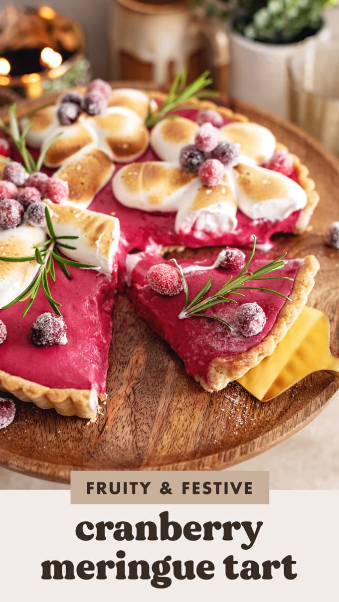 A slice of cranberry meringue tart cut from the rest of the tart.