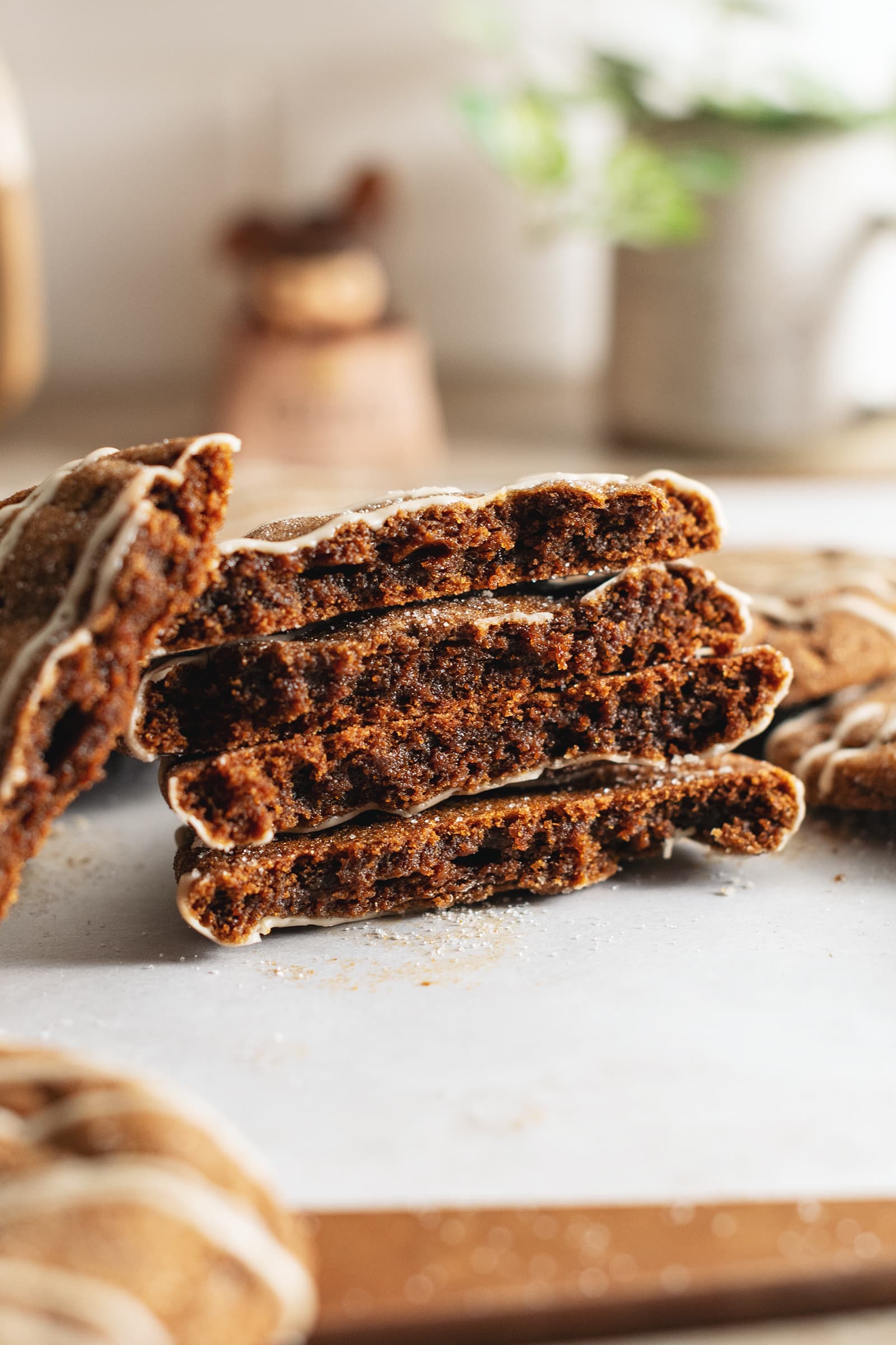 A stack of gingerbread latte cookies cut in half to show the texture inside.