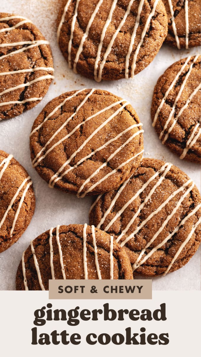 Gingerbread latte cookies drizzled with icing scattered on parchment paper.