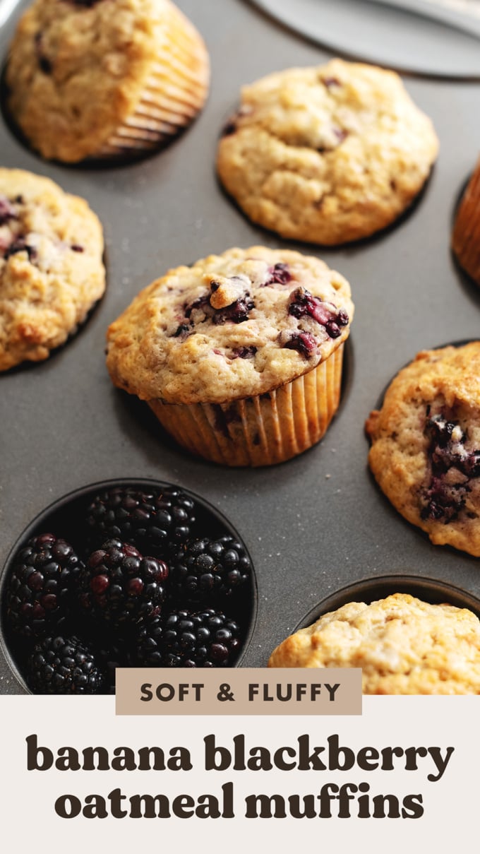 A muffin tilted out of the muffin pan to show the muffin liner.