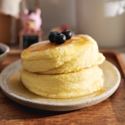A stack of two Japanese souffle pancakes on a plate.