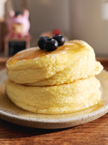 A stack of two Japanese souffle pancakes on a plate.