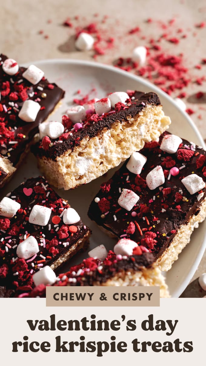 A Valentine's Day rice krispie treat leaning on its side to show the layers of chocolate ganache and rice krispies.
