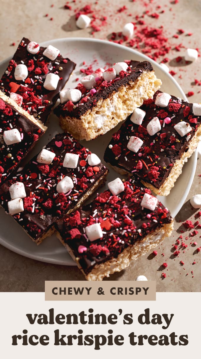 Rice krispie treats covered with chocolate and sprinkles on a plate.