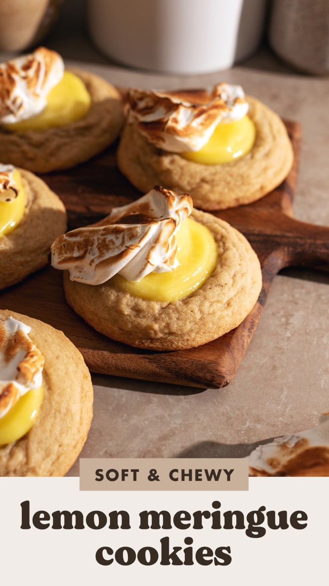 Lemon meringue cookies on a wooden platter.