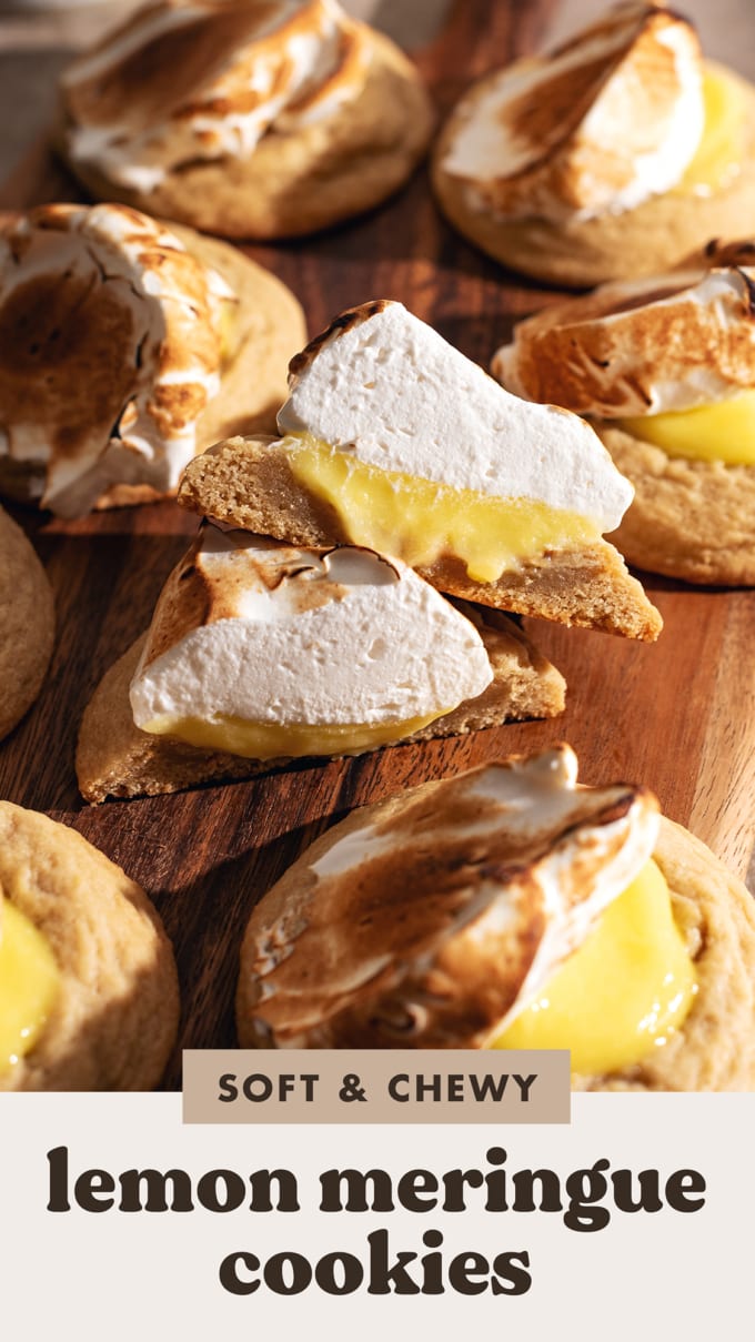 Two halves of a lemon meringue cookie resting on each other to show the cross-section inside.
