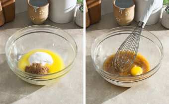 Left to right: melted butter and sugar in a mixing bowl, a whisk and an egg a mixing bowl of butter and sugar.