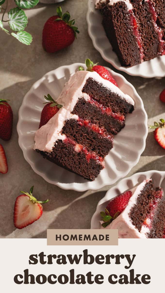 A slice of strawberry chocolate cake on a plate with four layers of chocolate cake and strawberry jam in between the layers.