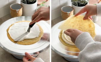 Left to right: spreading whipped cream on top of a crepe with an offset spatula, hand placing a crepe on top of whipped cream layer.