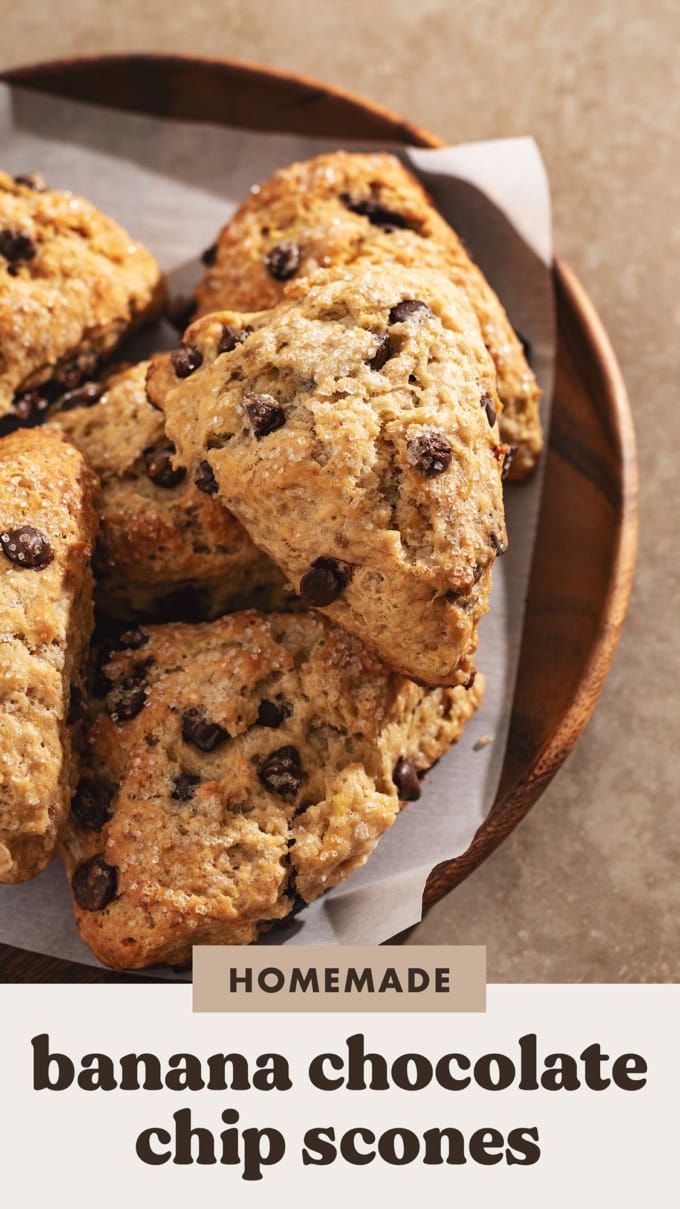 Banana chocolate chip scones piled on a wooden tray.
