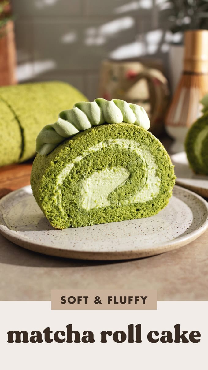 A slice of matcha roll cake on a plate showing a perfect swirl.