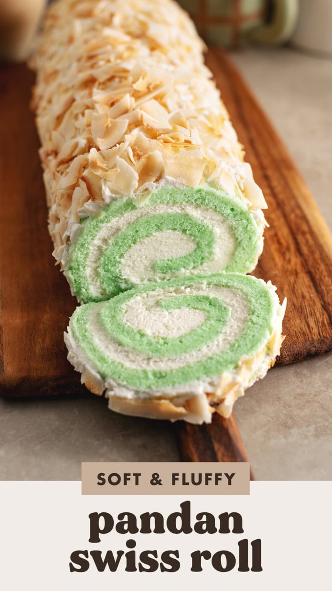 A slice of pandan swiss roll cake cut from the roll and laying in front of the rest of the roll cake.
