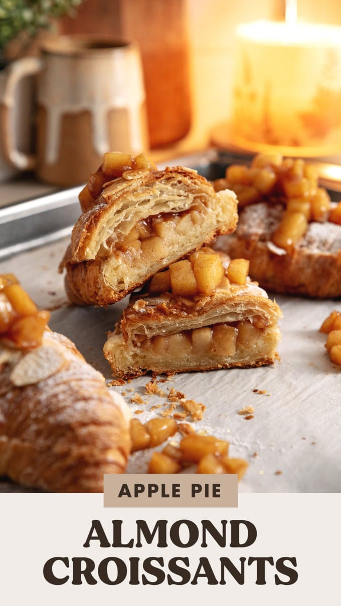An apple pie almond croissant cut in half to show the filling inside.