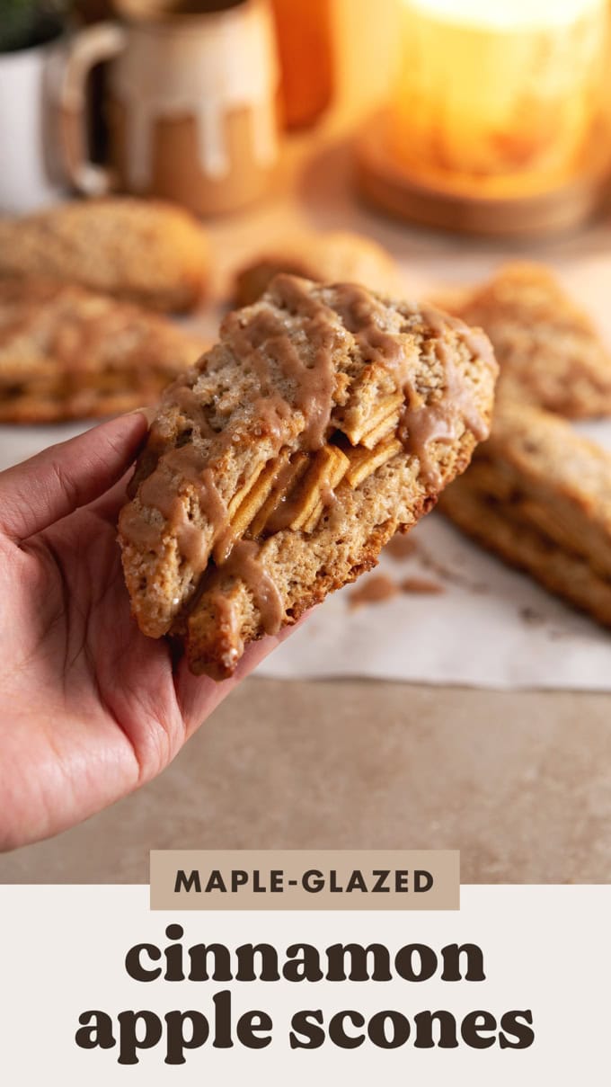 Hand holding a cinnamon apple scone.
