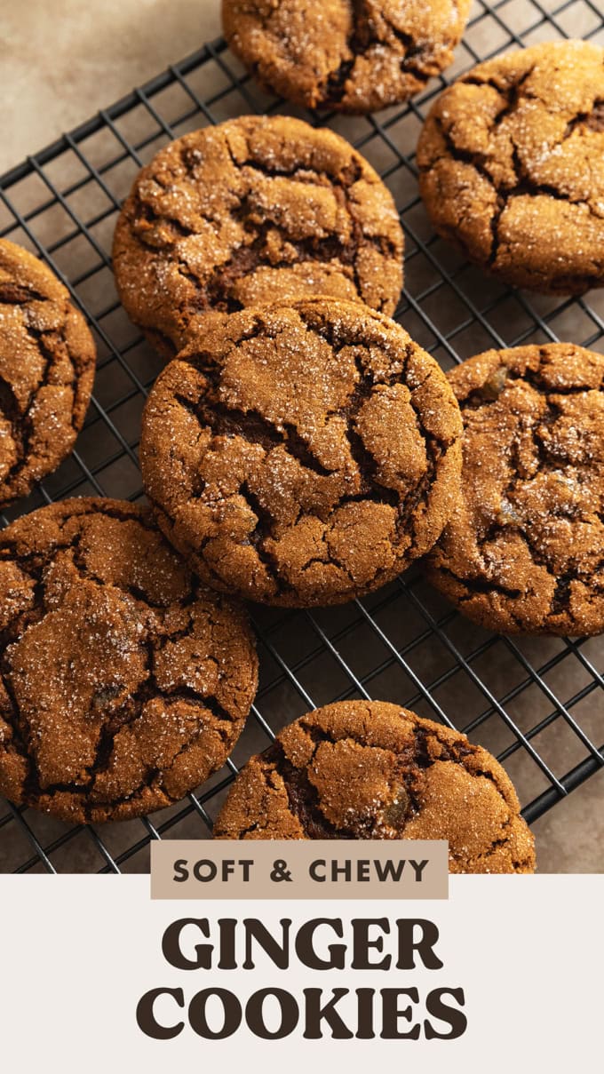 Chewy ginger cookies scattered on a wire rack.
