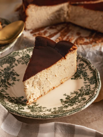 A slice of earl grey basque cheesecake on a floral plate.