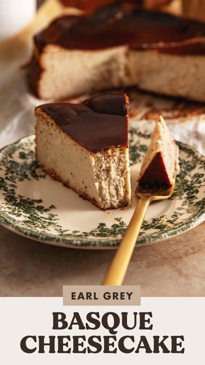 A slice of earl grey basque cheesecake and a forkful of cheesecake next to it on a plate.