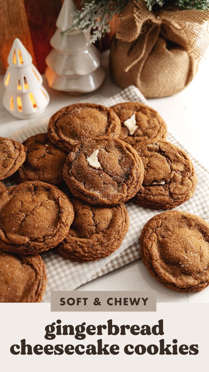 Gingerbread cheesecake cookies piled on a kitchen counter.