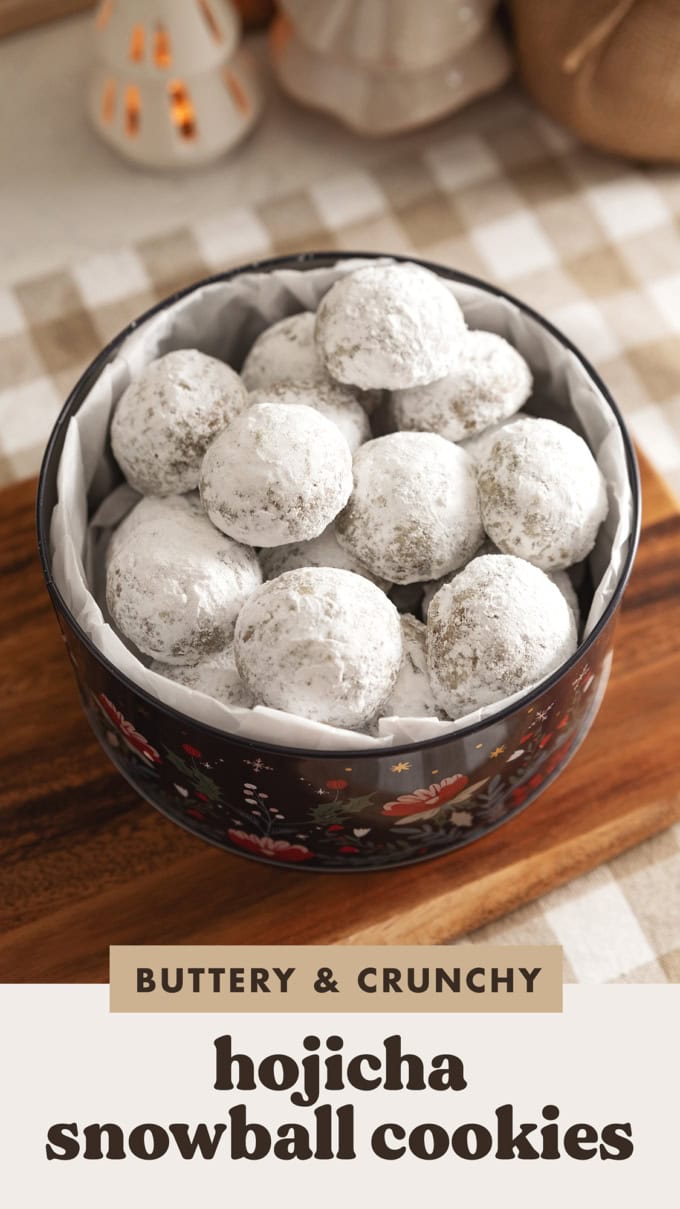 Hojicha snowball cookies piled in a cookie tin.