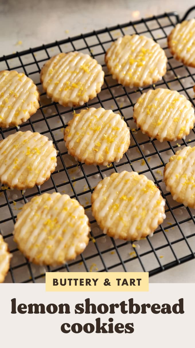 Lemon shortbread cookies lined up on a wire rack with drizzles of icing on top.