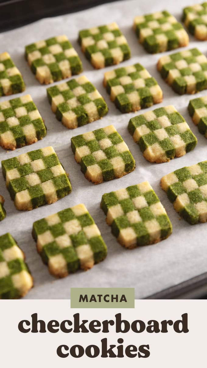 Matcha checkerboard cookies lined up on a baking sheet.