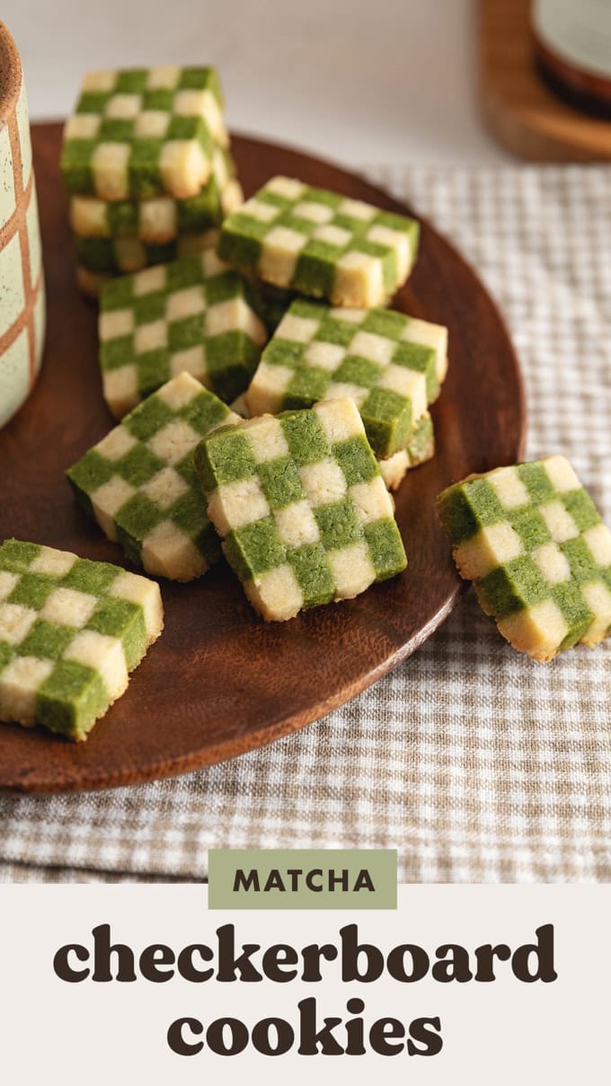 Matcha checkerboard cookies piled on a plate.